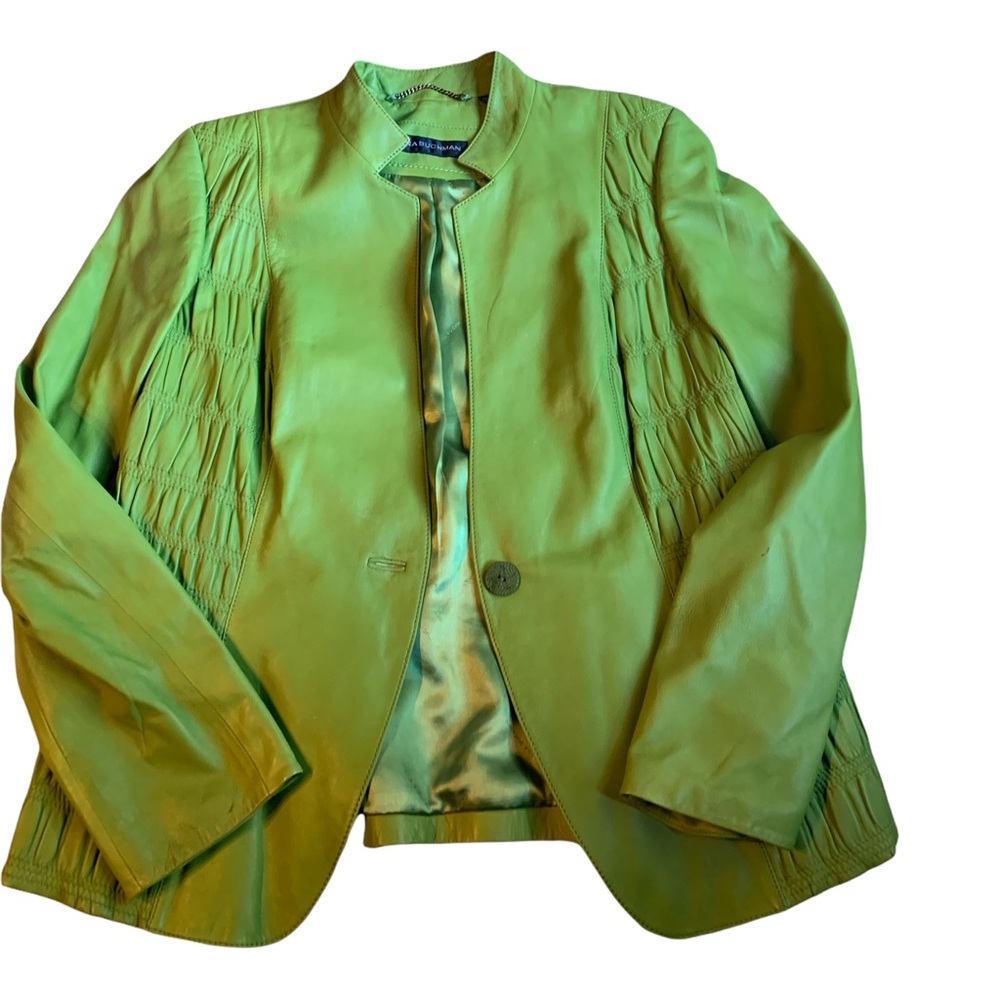 Unique soft leather gathering style on both jacket sides. One button closer.
